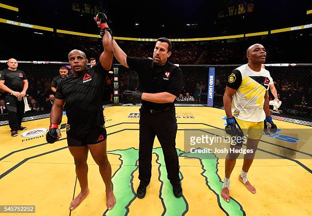 Daniel Cormier reacts to his victory over Anderson Silva of Brazil in their light heavyweight bout during the UFC 200 event on July 9, 2016 at...