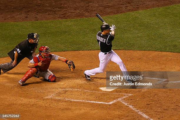 Brandon Barnes of the Colorado Rockies watches his RBI double during the sixth inning against the Philadelphia Phillies at Coors Field on July 9,...