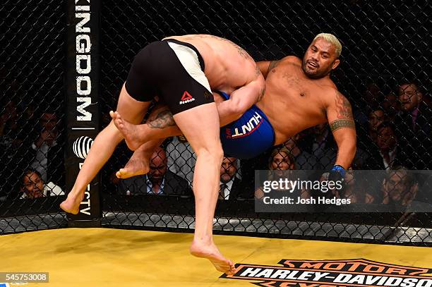 Brock Lesnar takes down Mark Hunt of New Zealand in their heavyweight bout during the UFC 200 event on July 9, 2016 at T-Mobile Arena in Las Vegas,...