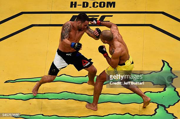 Jose Aldo of Brazil punches Frankie Edgar during the UFC 200 event on July 9, 2016 at T-Mobile Arena in Las Vegas, Nevada.