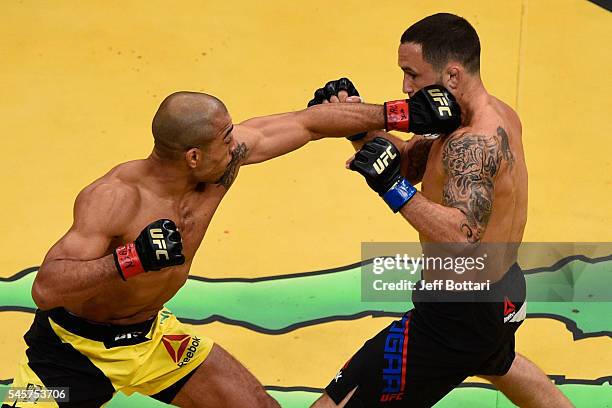 Jose Aldo of Brazil punches Frankie Edgar during the UFC 200 event on July 9, 2016 at T-Mobile Arena in Las Vegas, Nevada.