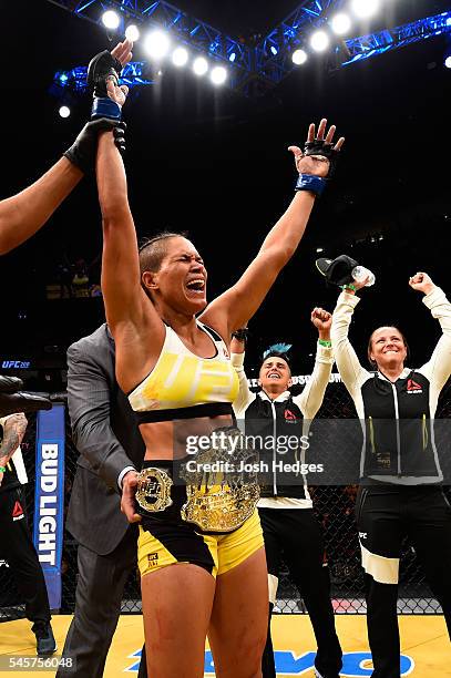 Amanda Nunes of Brazil reacts to her victory over Miesha Tate in their UFC women's bantamweight championship bout during the UFC 200 event on July 9,...