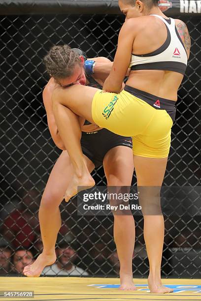 Amanda Nunes knees Miesha Tate during the UFC 200 event at T-Mobile Arena on July 9, 2016 in Las Vegas, Nevada.