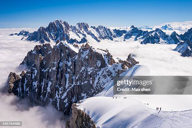 mountaineering at aiguille du midi in chamonix mont blanc, france. - aiguille de midi fotografías e imágenes de stock