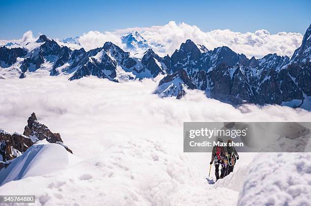 mountaineering at aiguille du midi in chamonix mont blanc, france. - aiguille de midi fotografías e imágenes de stock