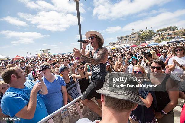 Musician Zachary Barnett of American Authors performs in the crowd at Moonlight Beach on July 9, 2016 in Encinitas, California.