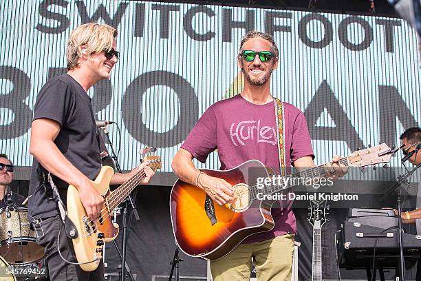 Surfing legend Rob Machado and bassist Tim Foreman of Switchfoot perform on stage at Moonlight Beach on July 9, 2016 in Encinitas, California.