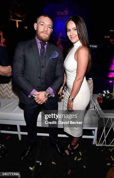 Mixed martial artist Conor McGregor and Dee Devlin attend his birthday celebration at Intrigue Nightclub at Wynn Las Vegas early July 10, 2016 in Las...