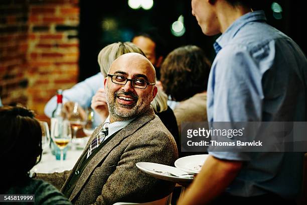 man in discussion with server during dinner - dining experience stock pictures, royalty-free photos & images