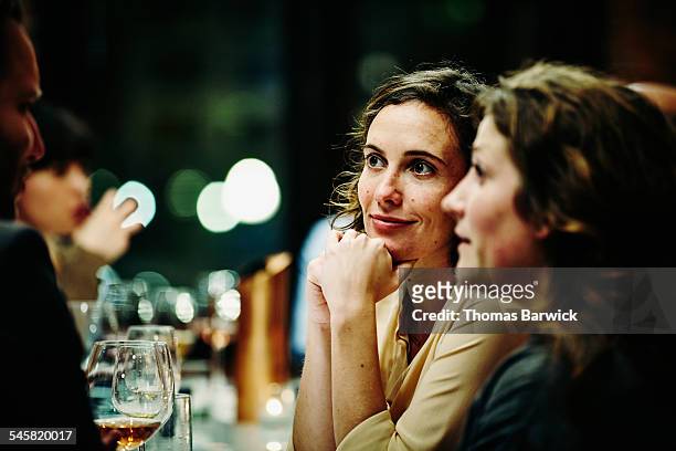 smiling friends talking at dinner party - fine dining foto e immagini stock