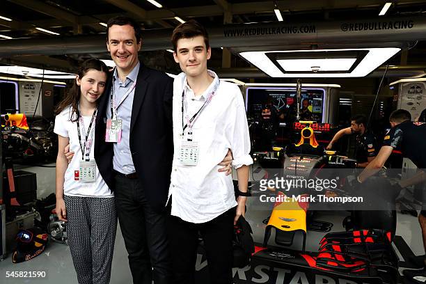 Chancellor of the Exchequer, George Osborne with his children Luke and Liberty outside the Red Bull Racing garage before the Formula One Grand Prix...