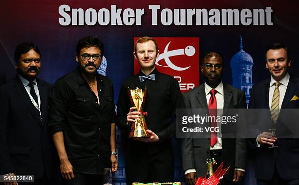 Anthony McGill of Scotland poses with trophy after winning the final match against Kyren Wilson of England on day five of Indian Open 2016 at...