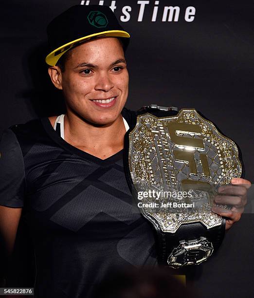 Women's bantamweight champion Amanda Nunes of Brazil speaks to the media during the UFC 200 post-fight press conference at T-Mobile Arena on July 9,...