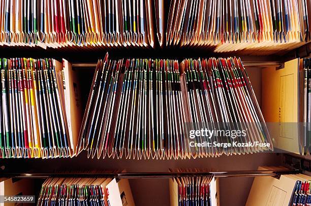 three rows of hanging file folders - hanging file stock pictures, royalty-free photos & images