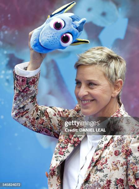 Actress and television host Ellen DeGeneres poses for photographers as she arrives to attend the UK premiere of the film 'Finding Dory' in London's...