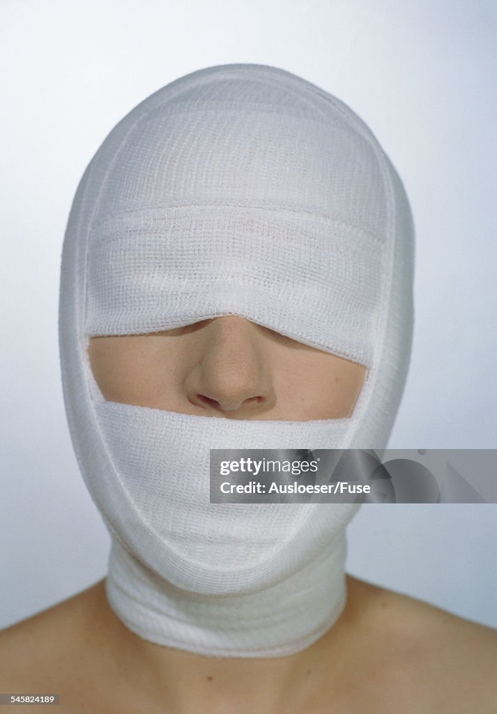 Woman with bandage around the head