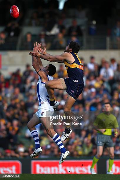 Josh Kennedy of the Eagles sets for a mark against Michael Firrito of the Kangaroos during the round 16 AFL match between the West Coast Eagles and...