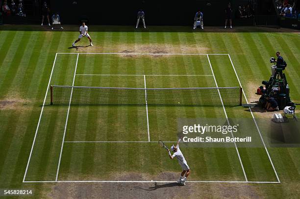 Andy Murray of Great Britain serves during the Men's Singles Final against Milos Raonic of Canada on day thirteen of the Wimbledon Lawn Tennis...