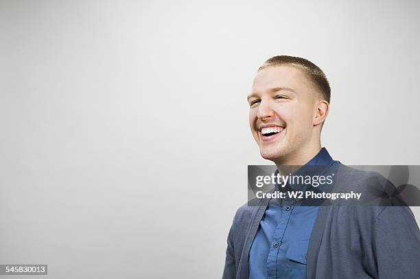young man smiling - w2 form stock pictures, royalty-free photos & images