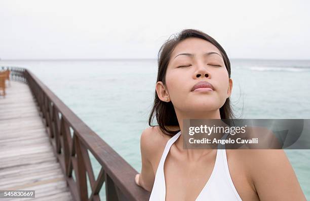 woman on pier - bandos foto e immagini stock