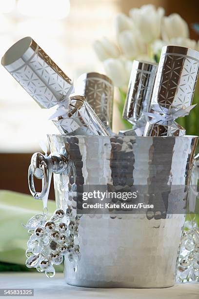 pail of christmas cracker toys - party popper christmas stock pictures, royalty-free photos & images