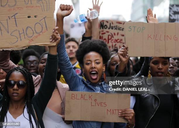 Demonstrators from the Black Lives Matter movement march through central London on July 10 during a demonstration against the killing of black men by...