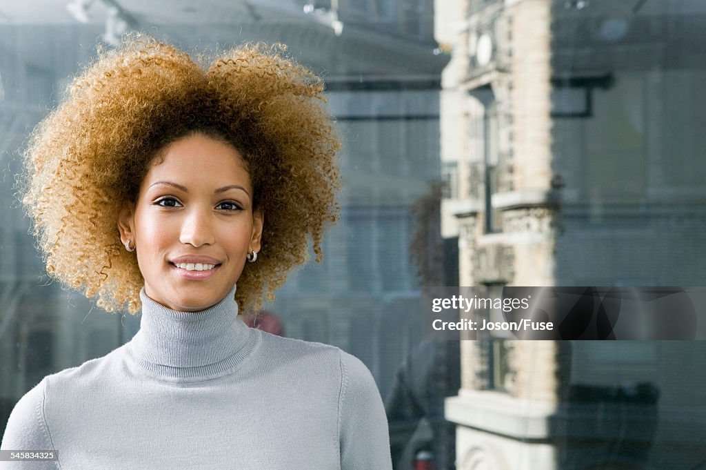 Smiling Woman in Front of Window