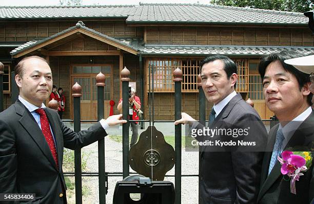 Taiwan - Taiwan President Ma Ying-jeou and Shuichi Hatta open a gate at Yoichi Hatta Memorial Park in Tainan, southern Taiwan, on May 8, 2011. A...
