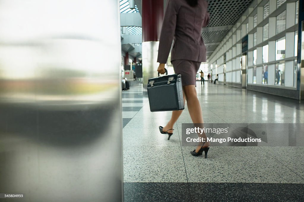 Businesswoman Carrying Briefcase