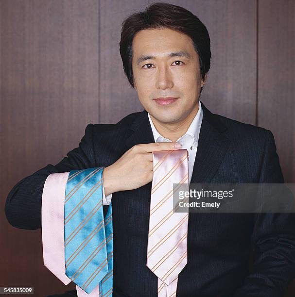 businessman selecting necktie - only japanese stock pictures, royalty-free photos & images