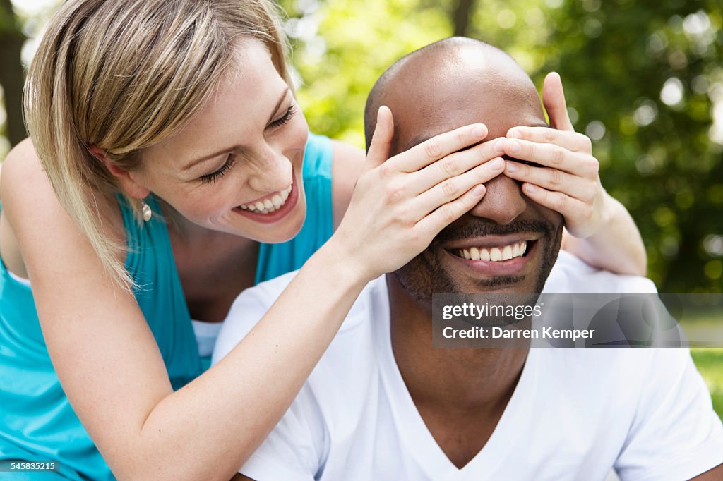 Playful young couple in a park