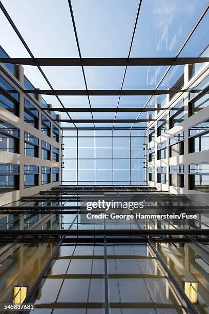 view of a skylight at the top of an office atrium - atrio fotografías e imágenes de stock