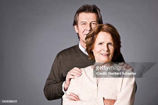 middle aged couple - couples studio portrait stock pictures, royalty-free photos & images