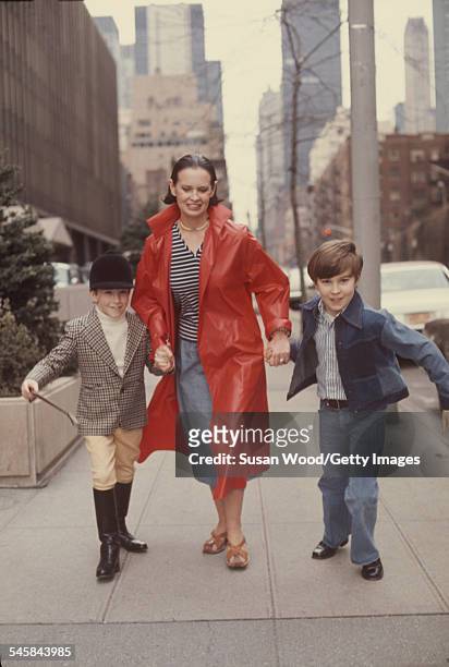 Swiss-born socialite Gloria Vanderbilt runs down a street with her two sons Anderson Cooper and Carter Vanderbilt Cooper , New York, New York, March...