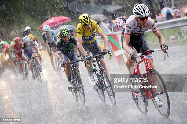 Christopher Froome of Great Britain riding for Team Sky rides in heavy rain duing stage nine of the 2016 Le Tour de France, a 184.5km stage from...