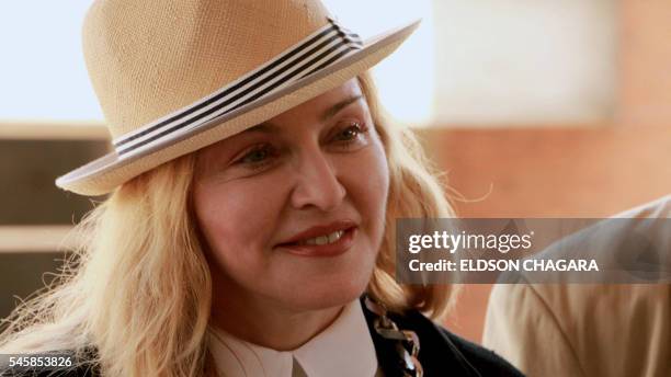 Pop diva Madonna looks on during the inspection of a 50-bed surgical unit for children that her charity, Raising Malawi, is funding at Queens...