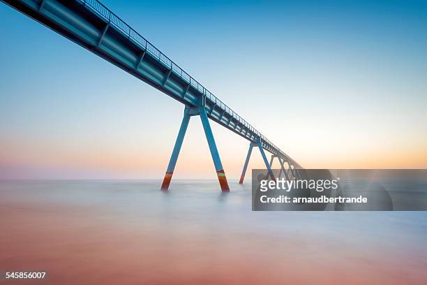 france, gironde, arcachon, la salie, view along elevated walkway leading across sea - bridge stock pictures, royalty-free photos & images