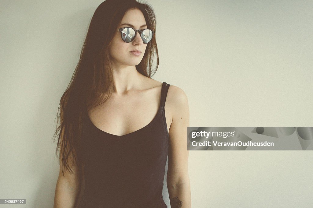 Young woman with sunglasses, portrait