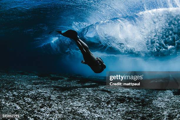 woman wearing mermaid flippers swimming underwater, hawaii, america, usa - real mermaid images stock pictures, royalty-free photos & images