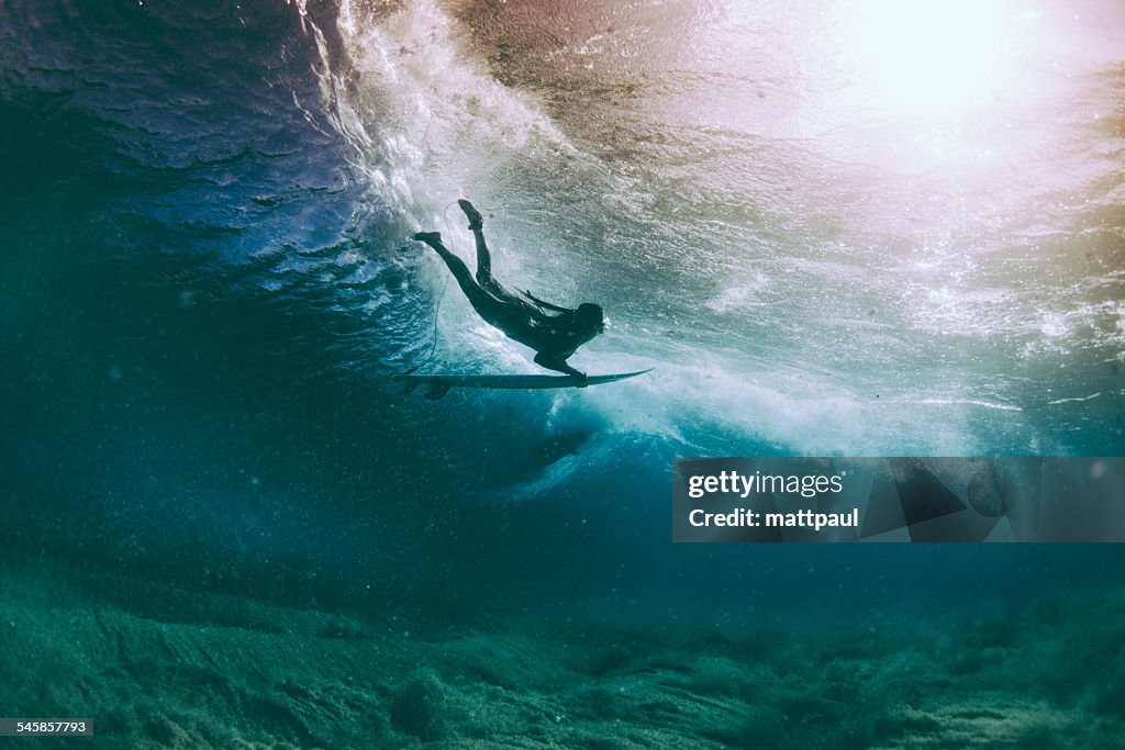 Surfer duck diving under a wave, Hawaii, America, USA