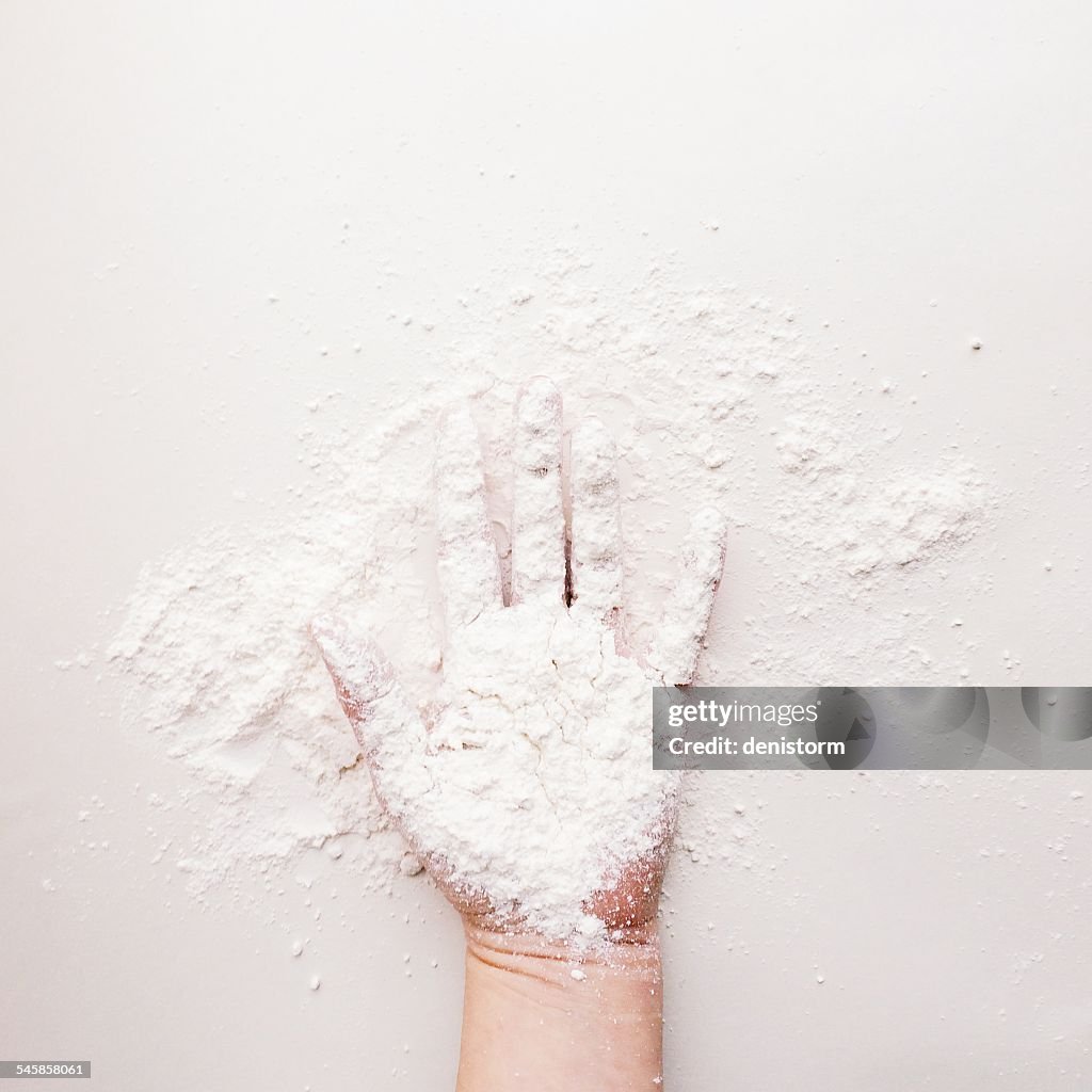 Hand covered in flour