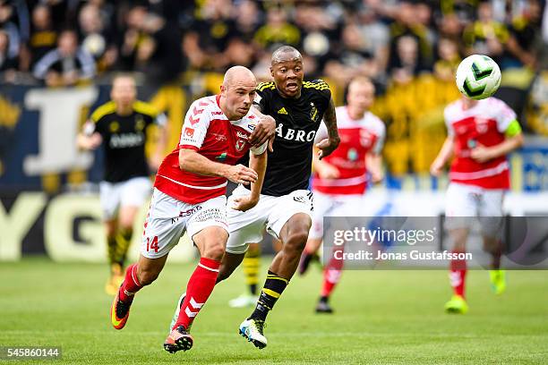 Stefan Larsson of Kalmar FF and Carlos Strandberg of AIK competes for the ball during the allsvenskan match between Kalmar FF and AIK at Guldfageln...