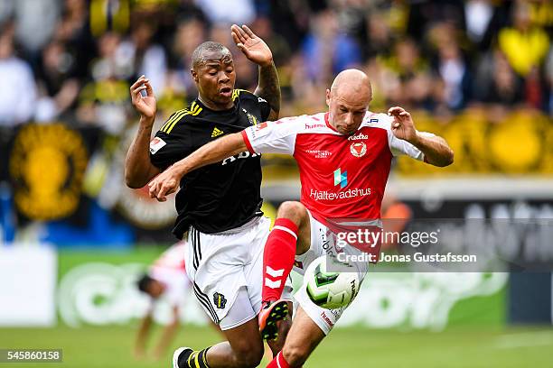 Stefan Larsson of Kalmar FF and Carlos Strandberg of AIK competes for the ball during the allsvenskan match between Kalmar FF and AIK at Guldfageln...