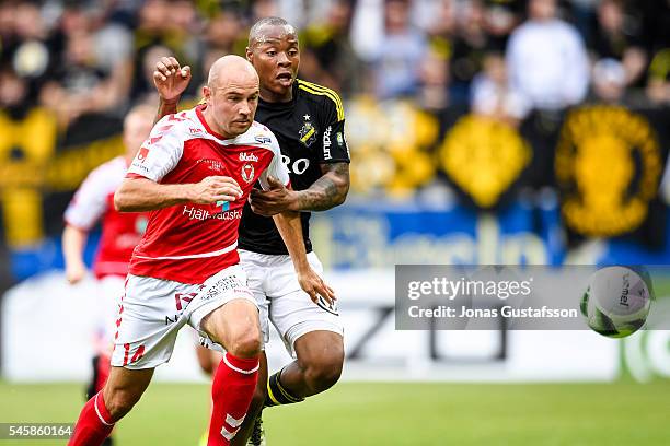 Stefan Larsson of Kalmar FF and Carlos Strandberg of AIK competes for the ball during the allsvenskan match between Kalmar FF and AIK at Guldfageln...