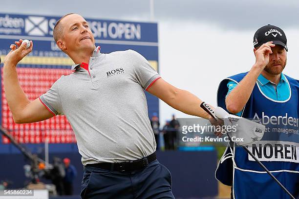 Alex Noren of Sweden throws his ball to the crowd after claiming victory on the 18th green during the final round of the AAM Scottish Open at Castle...