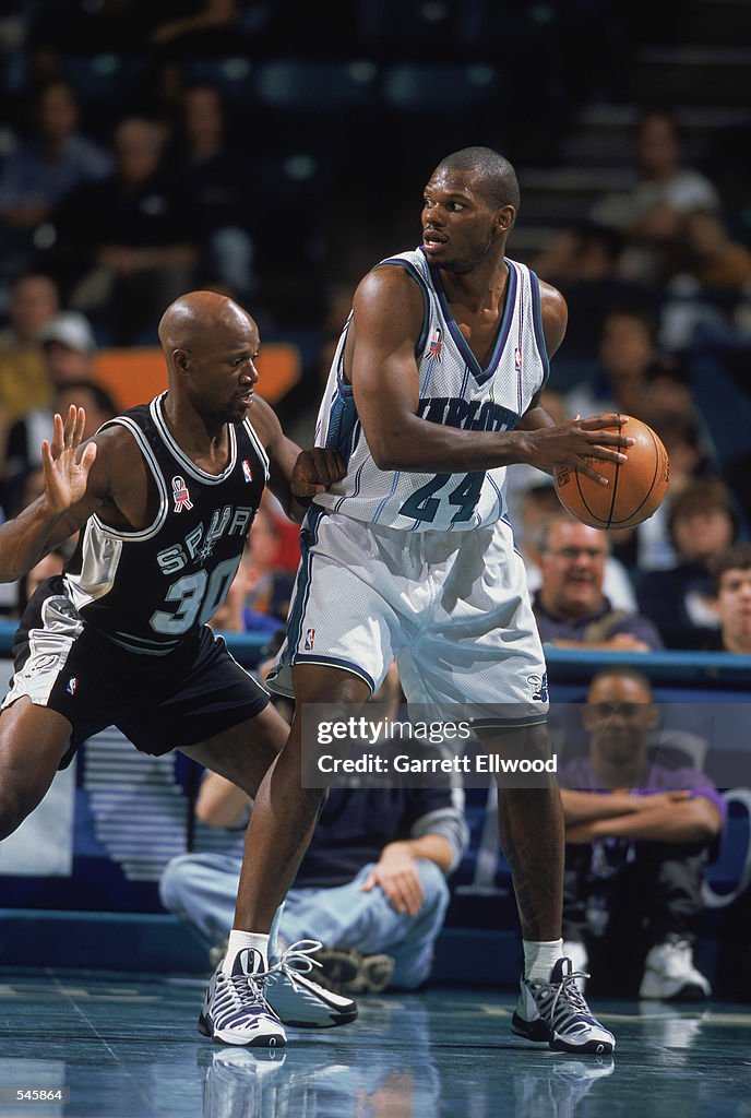 Forward Jamal Mashburn of the Charlotte Hornets holds the ball in the