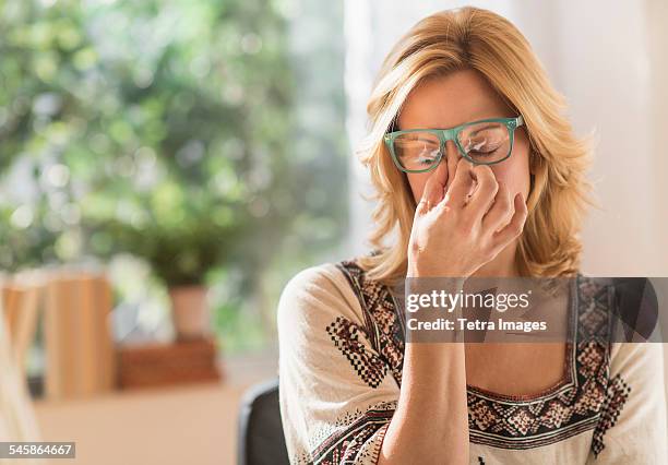 usa, new jersey, woman having headache - shiatsu stock pictures, royalty-free photos & images