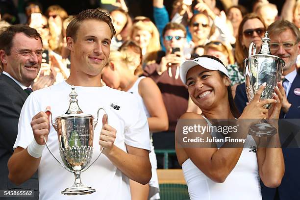 Heather Watson of Great Britain and Henri Kontinen of Finland lift their trophies following victory in the Mixed Doubles Final against Robert Farah...