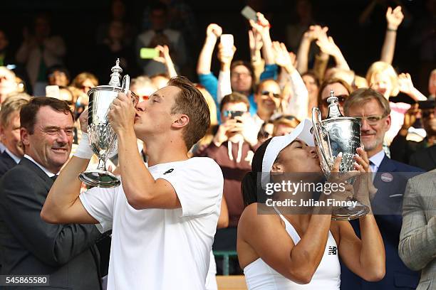 Heather Watson of Great Britain and Henri Kontinen of Finland kiss their trophies following victory in the Mixed Doubles Final against Robert Farah...