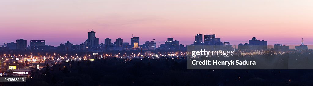 Canada, Manitoba, Winnipeg, Purple cityscape at sunset